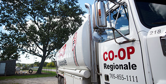 Heating Oil Truck seen at an angle with the Co-op Régionale logo on it.